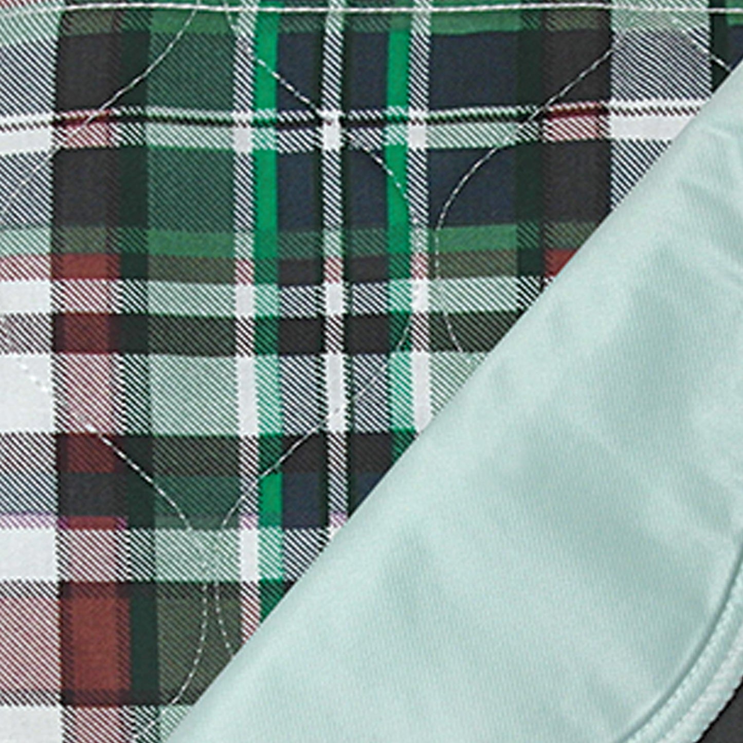 Close-up of plaid fabric with a light blue garment
