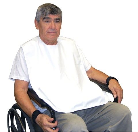Man wearing a bib sitting in a wheelchair