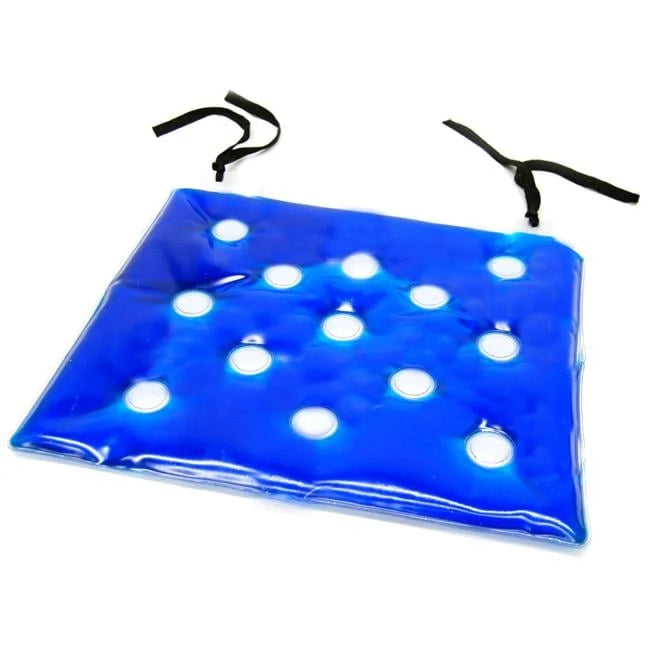 Blue mat with white circular holes and two black clips on a white background
