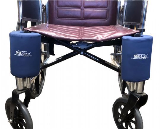 Wheelchair with purple seat and blue armrest covers on a white background