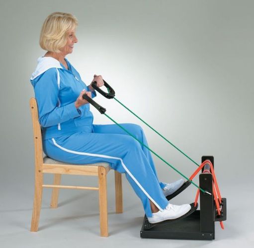 Woman exercising using a chair-based fitness device with resistance bands.