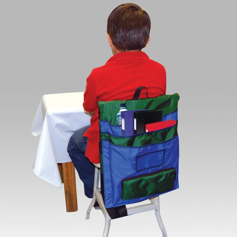 Child sitting on a chair with a colorful backpack
