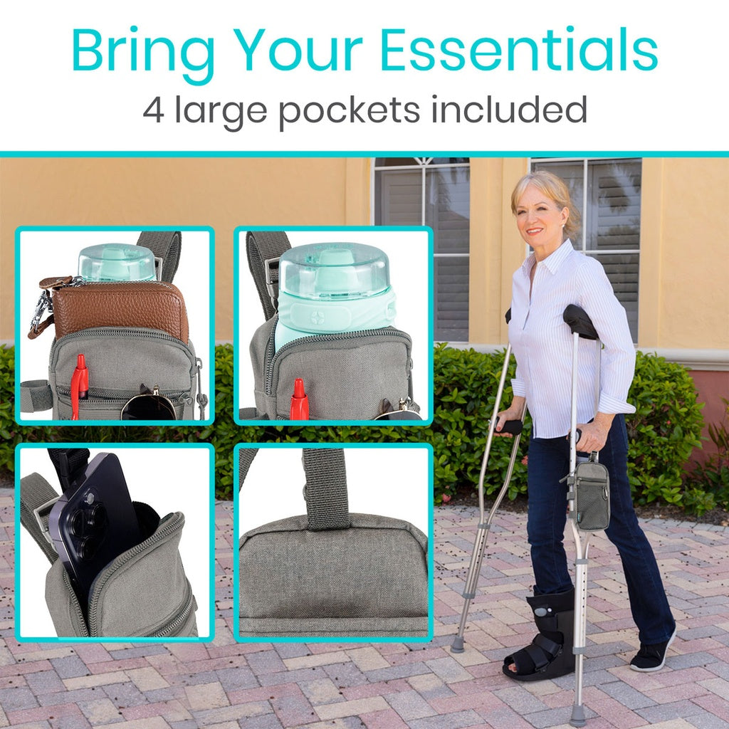 Woman using crutches with a gray bag featuring large pockets, including a water bottle and phone.