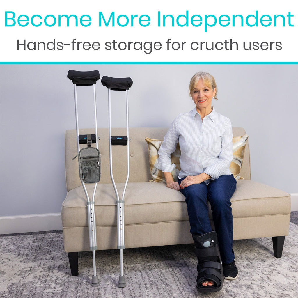 Woman sitting on a couch with crutches and a storage bag, text 'Become More Independent: Hands-free storage for crutch users'.