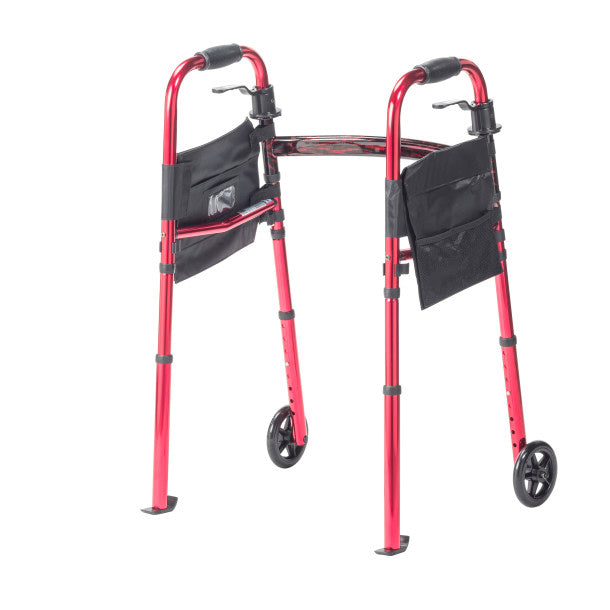 Red walker with wheels and black bags on a white background