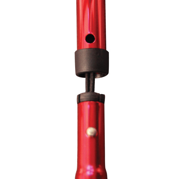 Close-up of a red pen with a black clip on a white background