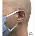 Person wearing a surgical mask on a plain background