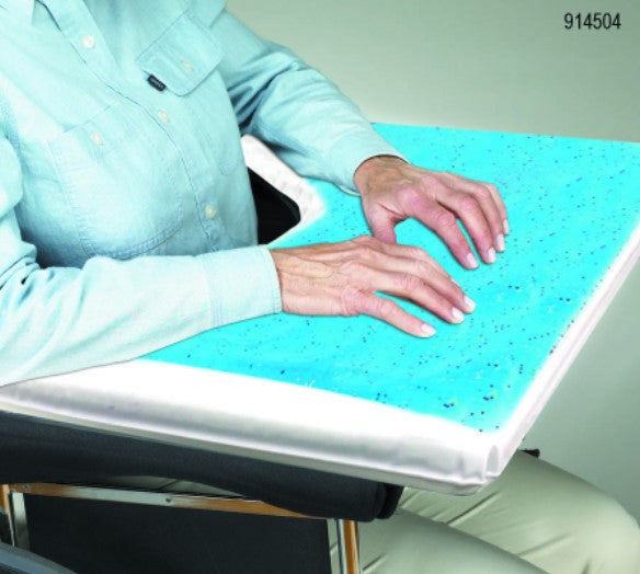 Person using a blue gel wrist rest on a desk