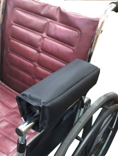 Wheelchair with a black armrest cover on a white background