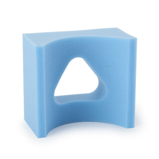 Blue foam block with a triangular hole on a white background