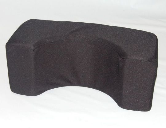 Black wedge-shaped pillow on a white background