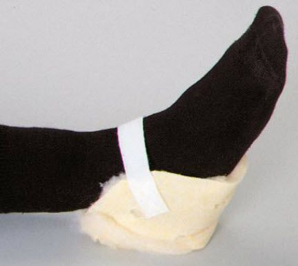 Black sock with white band and beige paw on a gray background