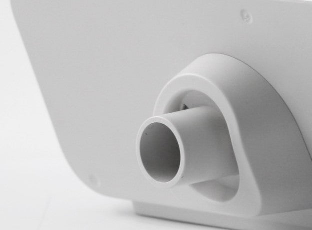 Close-up of a white cylindrical object on a light gray background