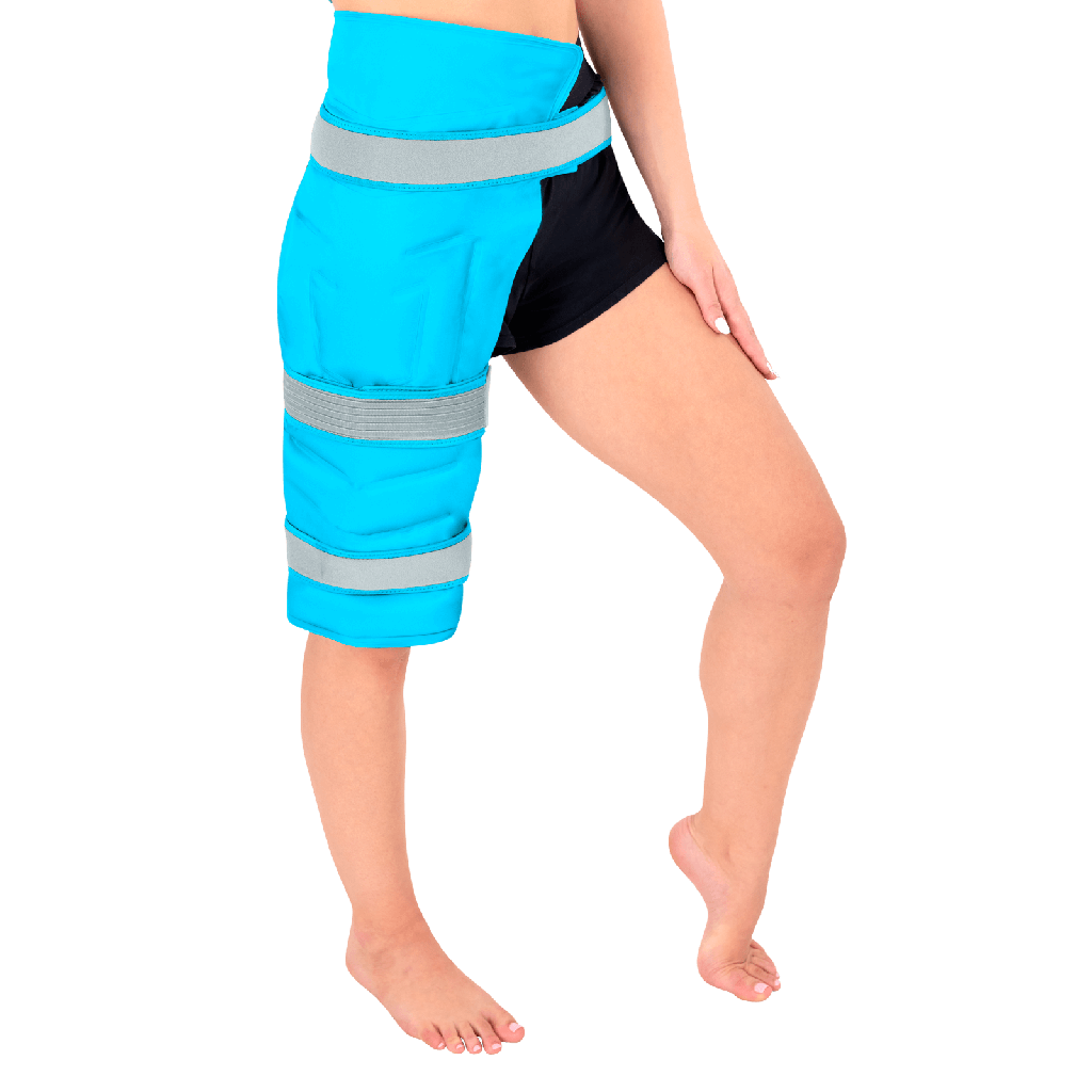 Person wearing blue leggings with reflective stripes on a black background