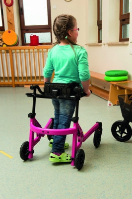 Child using a walker in a classroom setting