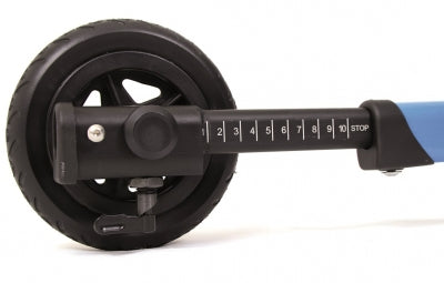 Close-up of a wheel with measurement scale on a white background