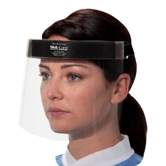 Woman wearing a clear face shield with a black band on a white background