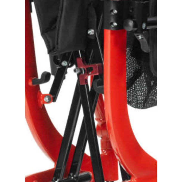 Close-up of a red and black mechanical component, possibly part of a vehicle or machinery.