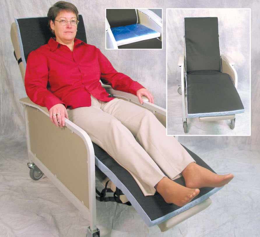 Person using a reclining chair with additional cushions, on a plain background
