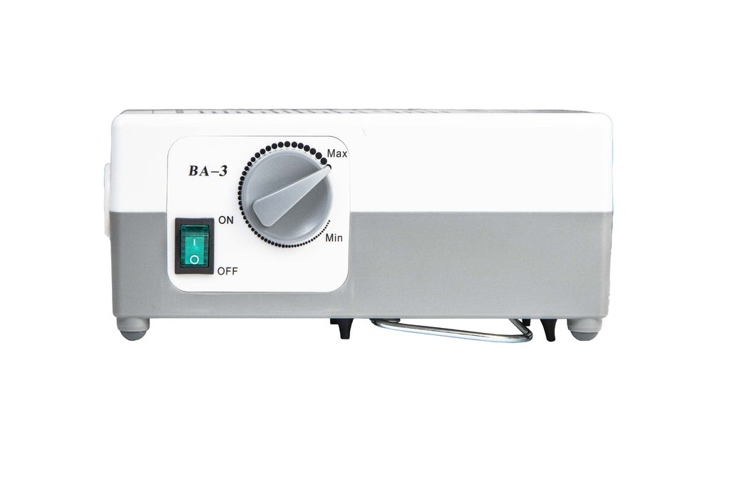 White electronic device with a dial and indicator lights on a white background