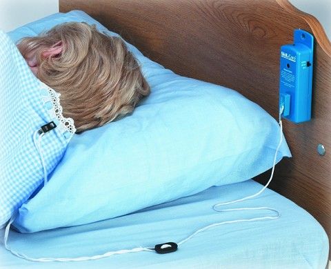 laying in bed using a bed alarm