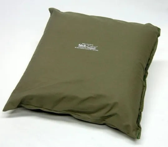 Green cushion with a visible brand logo on a white background