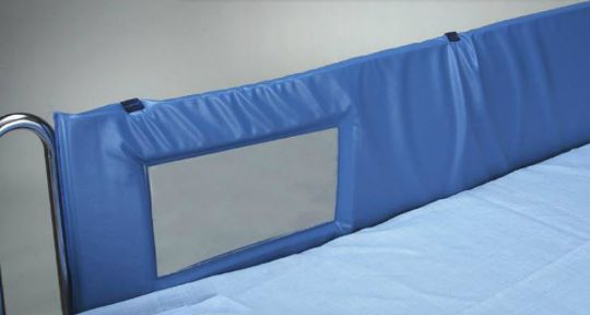 Blue bed rail with a clear plastic panel on a bed