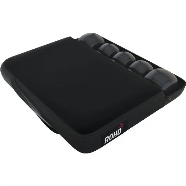 Black wheelchair cushion with 'ROHO' branding on a white background