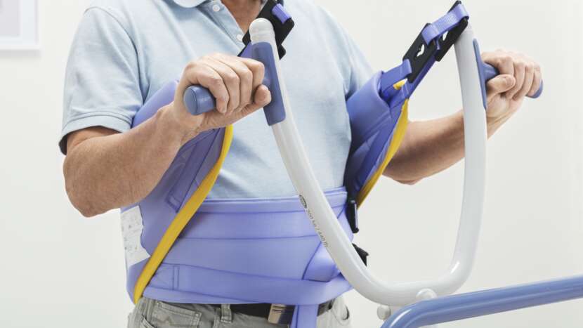 Person using a physical therapy device with a white background