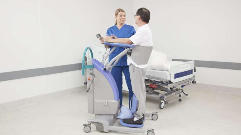 caregiver helping client move with a lift