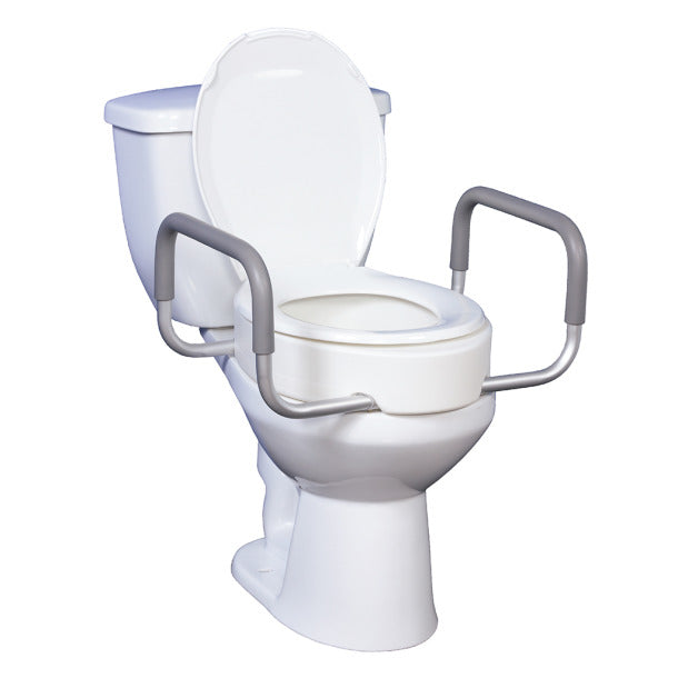 White toilet with raised seat and gray safety rails on a white background