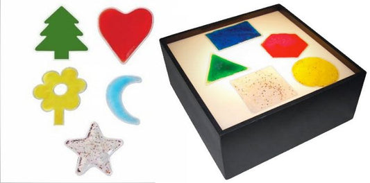 Colorful geometric shapes on a light box with shapes displayed
