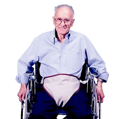 Man in a wheelchair wearing a light blue shirt and dark pants on a white background