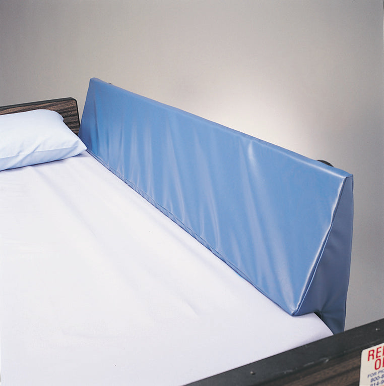 Blue bed safety rail against a gray wall