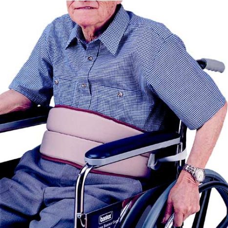 Person in a wheelchair with a support belt on a white background