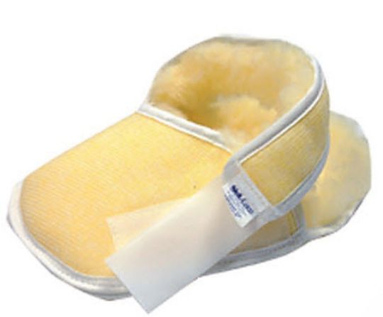 Yellow shoe with a white patch on a white background