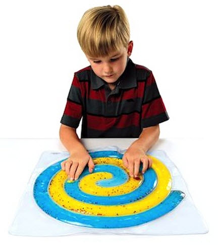 Child playing with a colorful maze toy on a white background