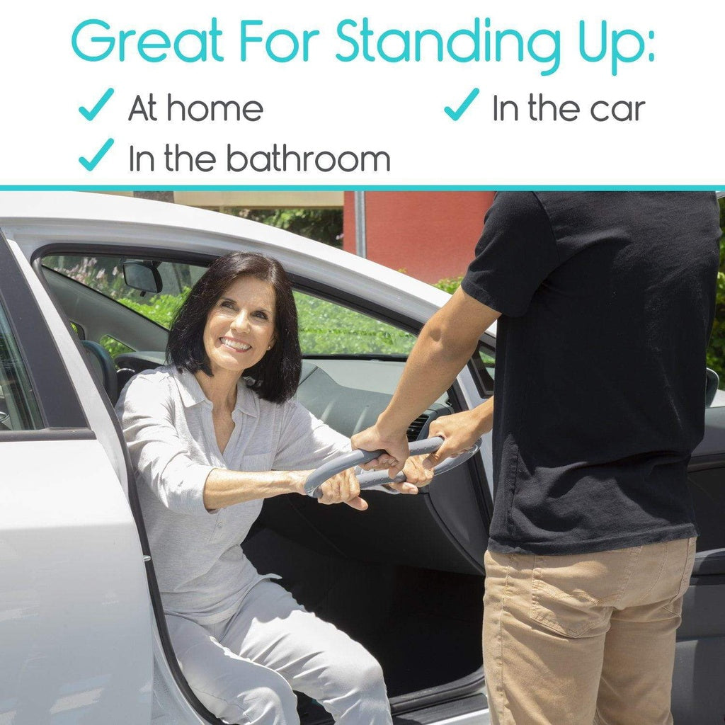 Woman using a car seat belt assist device with a man in a car.