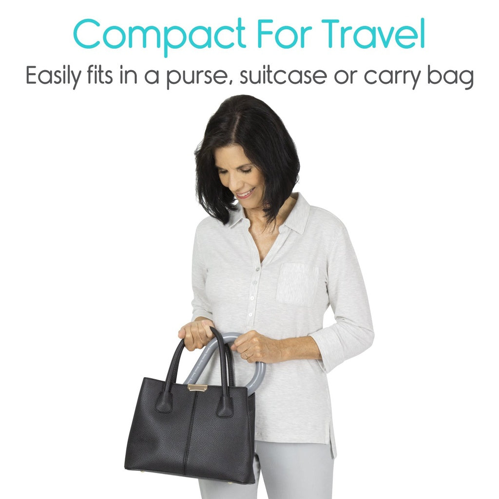Woman holding a black handbag with text about its compactness for travel.