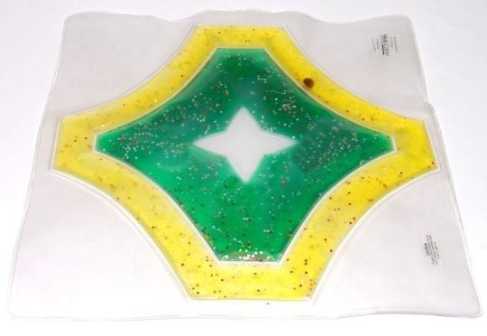 Hexagonal object with green center and yellow border on a white background