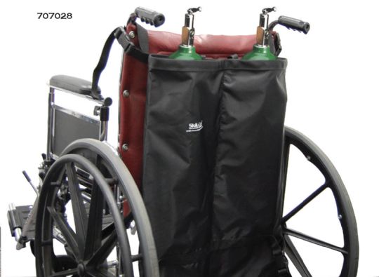 Wheelchair with oxygen tanks attached on a white background