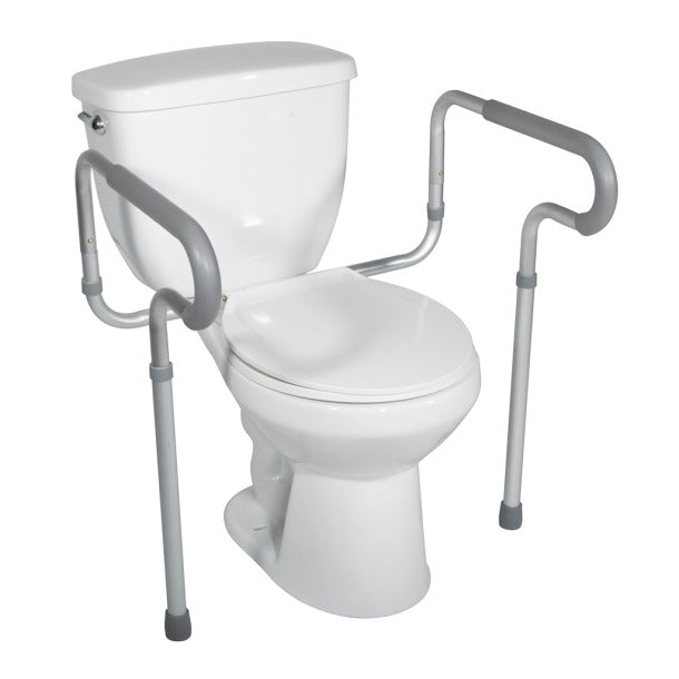 White toilet with a safety frame and handle on a white background