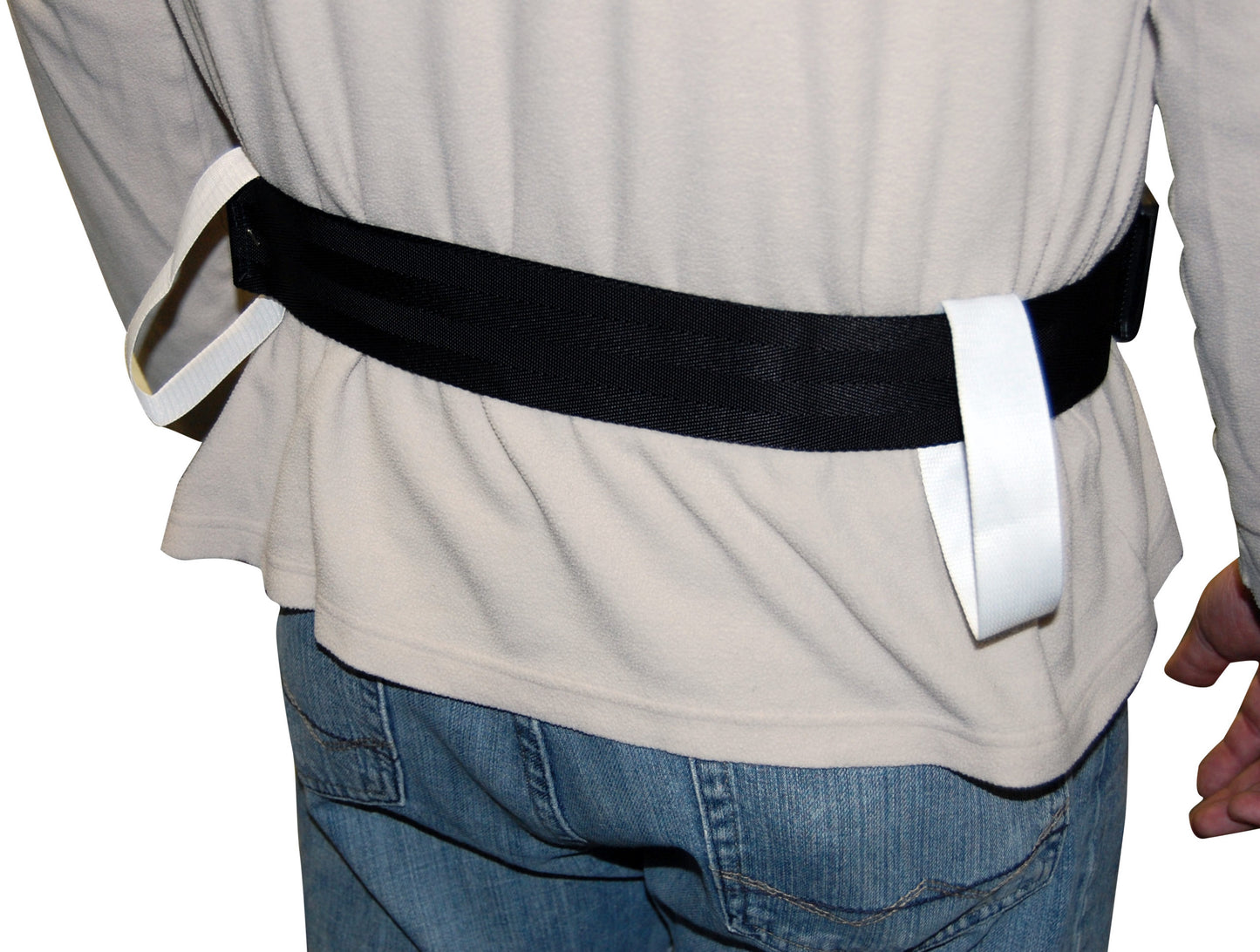 Person wearing a black belt with white buckles on a plain background