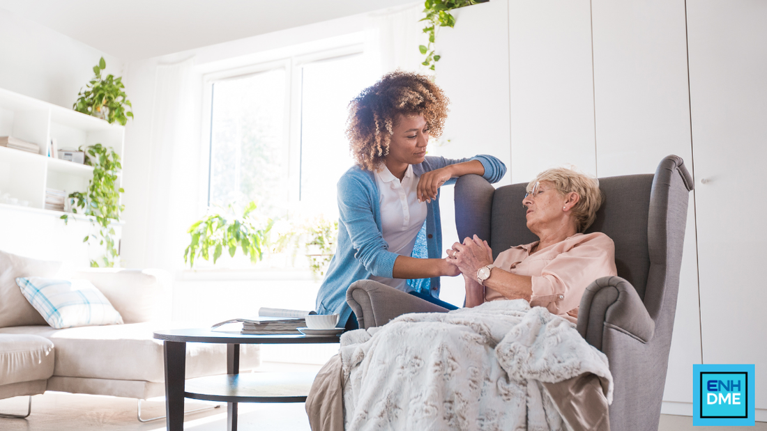 Caregiver sitting with a senior in a home care setting.