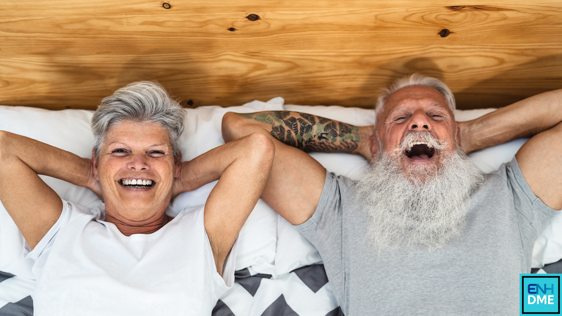 Couple lying in bed laughing