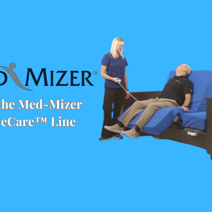 Caregiver adjusting a bed