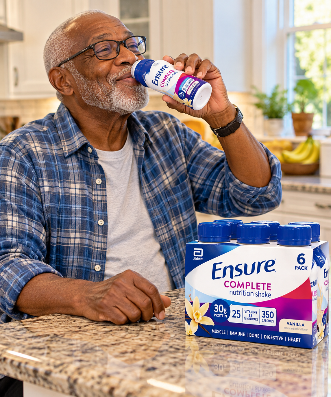 man drinking ensure in kitchen