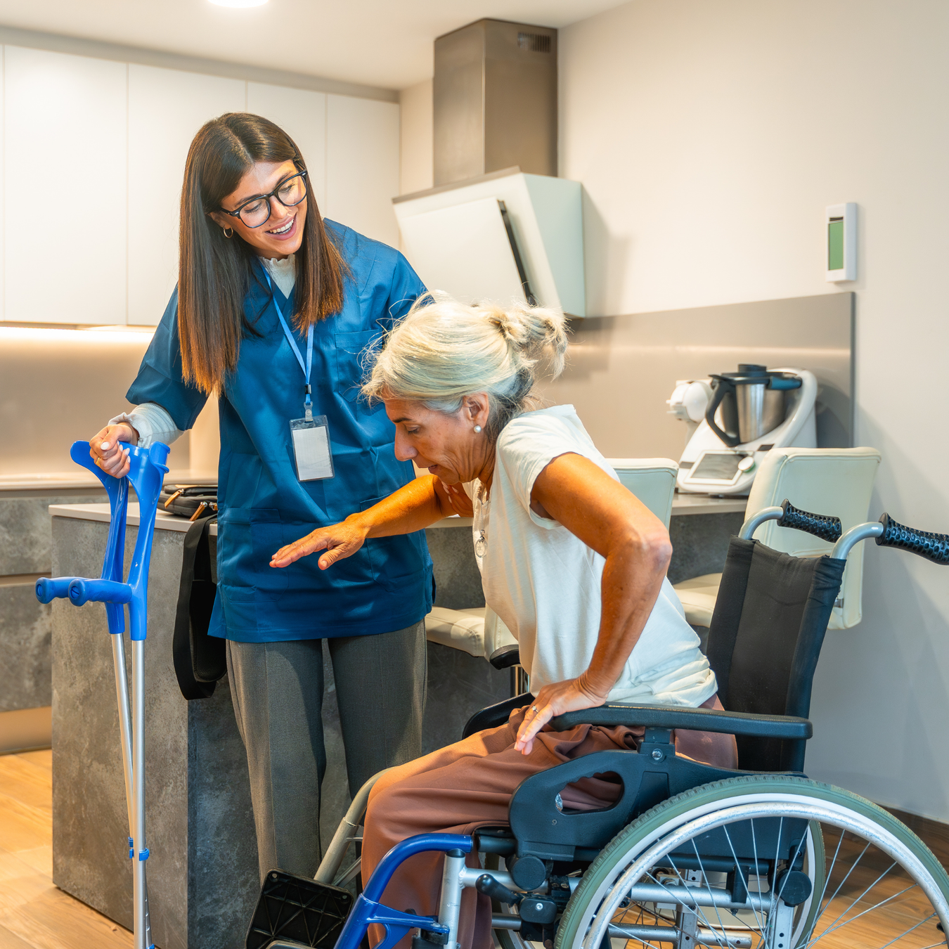 nurse helping an individual up