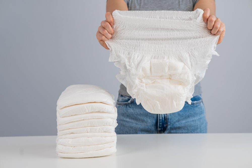 woman holding incontinence briefs