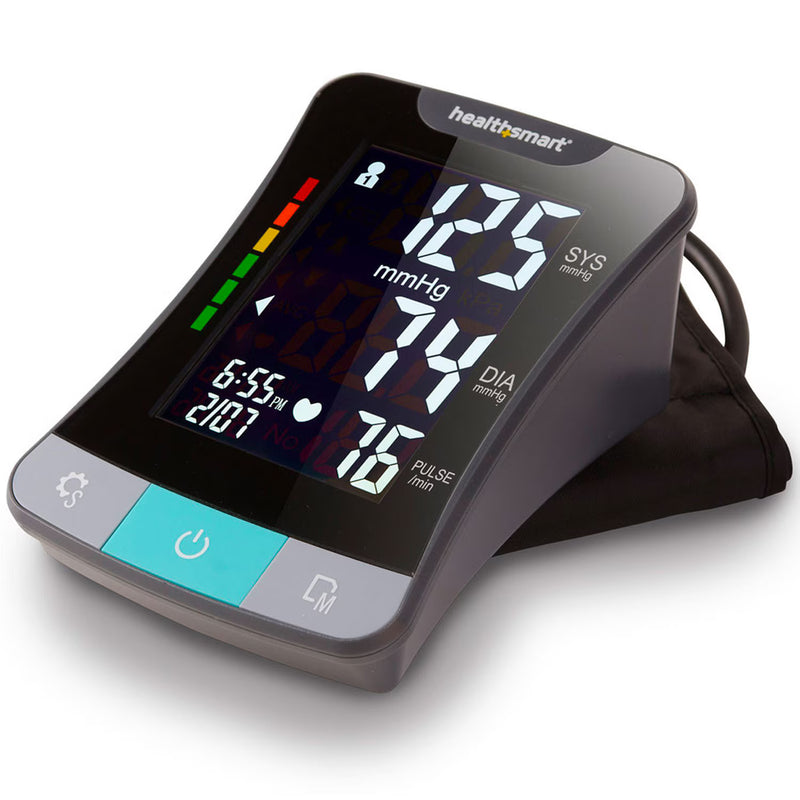 A Healthsmart digital blood pressure monitor with a black arm cuff, featuring a gray and black faceplate with a turquoise power button and white LED display showing blood pressure readings.